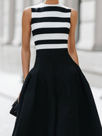 Vestido midi elegante de corte A, sin mangas, a rayas, con bolsillos
