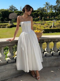 Elegante vestido de invitada de boda con corsé y escote favorecedor de fiesta | Midi