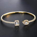 Brazalete Abierto de Oro con Dos Piedras