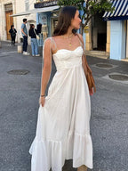 Elegante vestido largo blanco de invitada de boda y de ceremonia con tirantes finos y caída fluida | Maxi