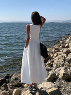 Elegante vestido de invitada de boda sin mangas con falda fruncida | Midi